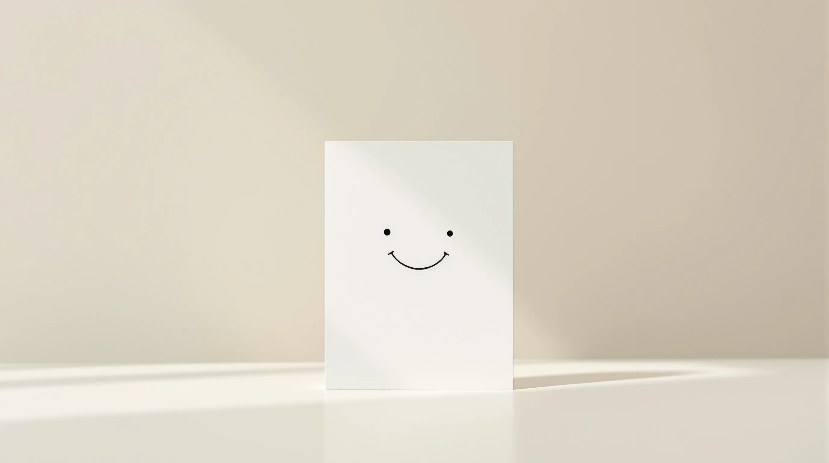 A minimal birthday card with a smirk icon on a clean white background.