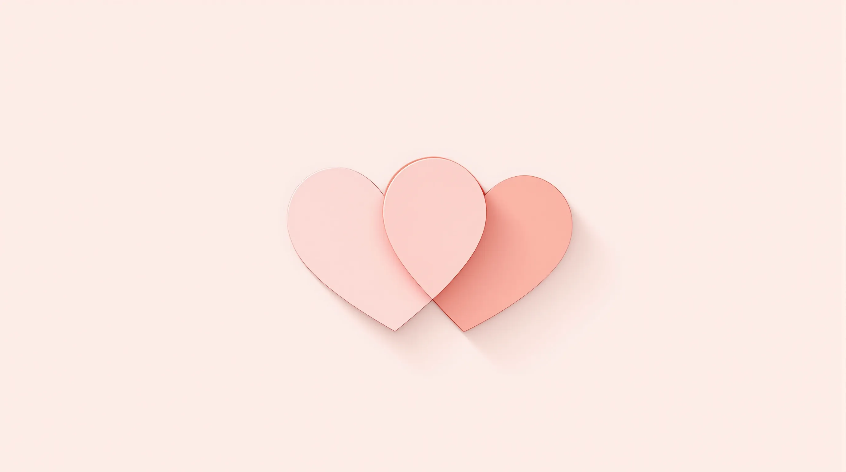 Two overlapping heart shapes in soft pink tones on white background.