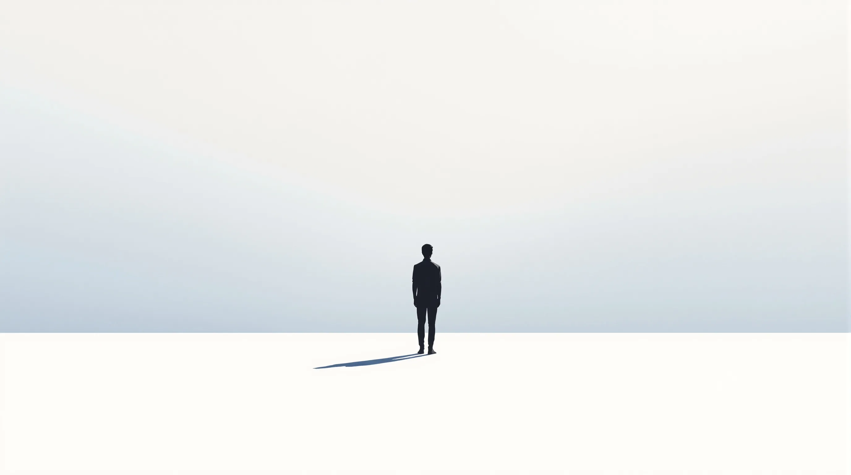 A lone silhouette with shadow in empty space, symbolizing quiet solitude.