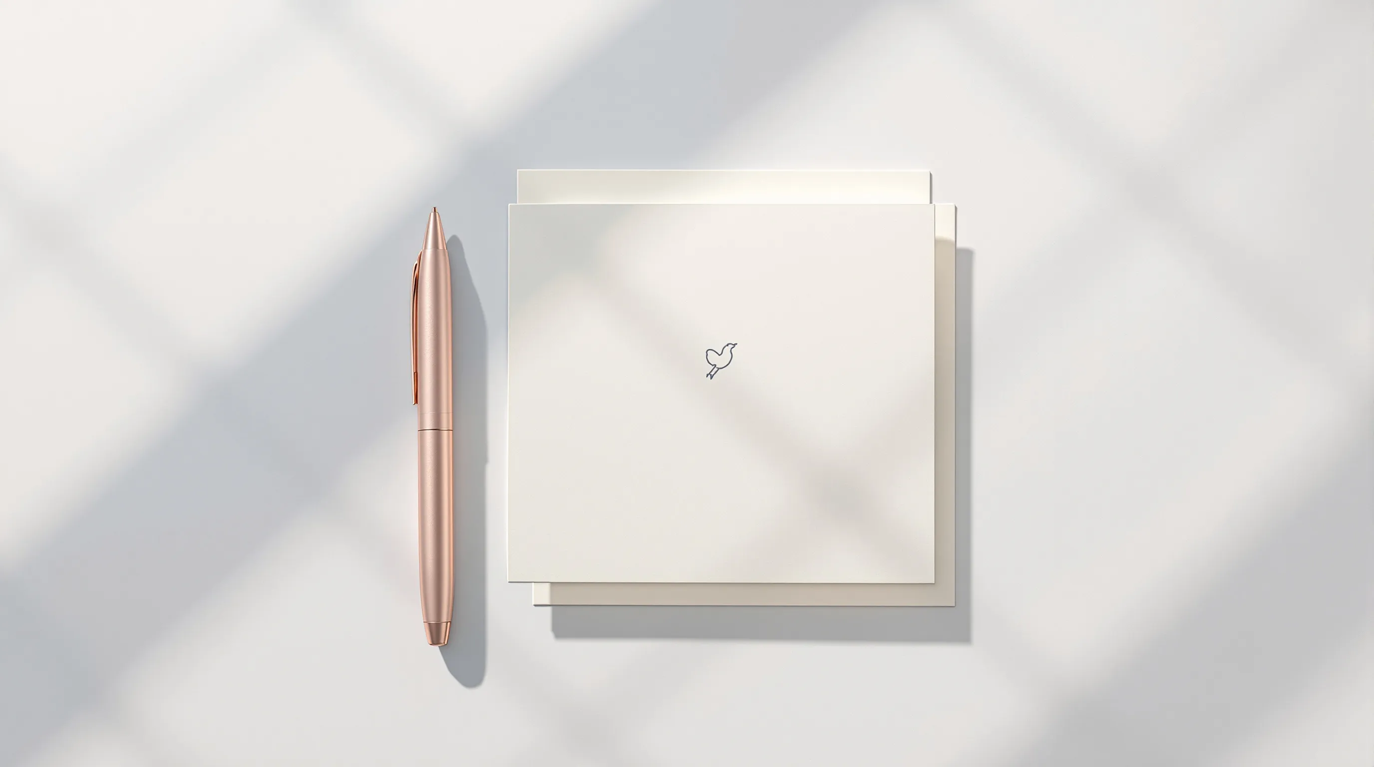 Minimalist greeting card with simple baby symbol and pen on clean white background.