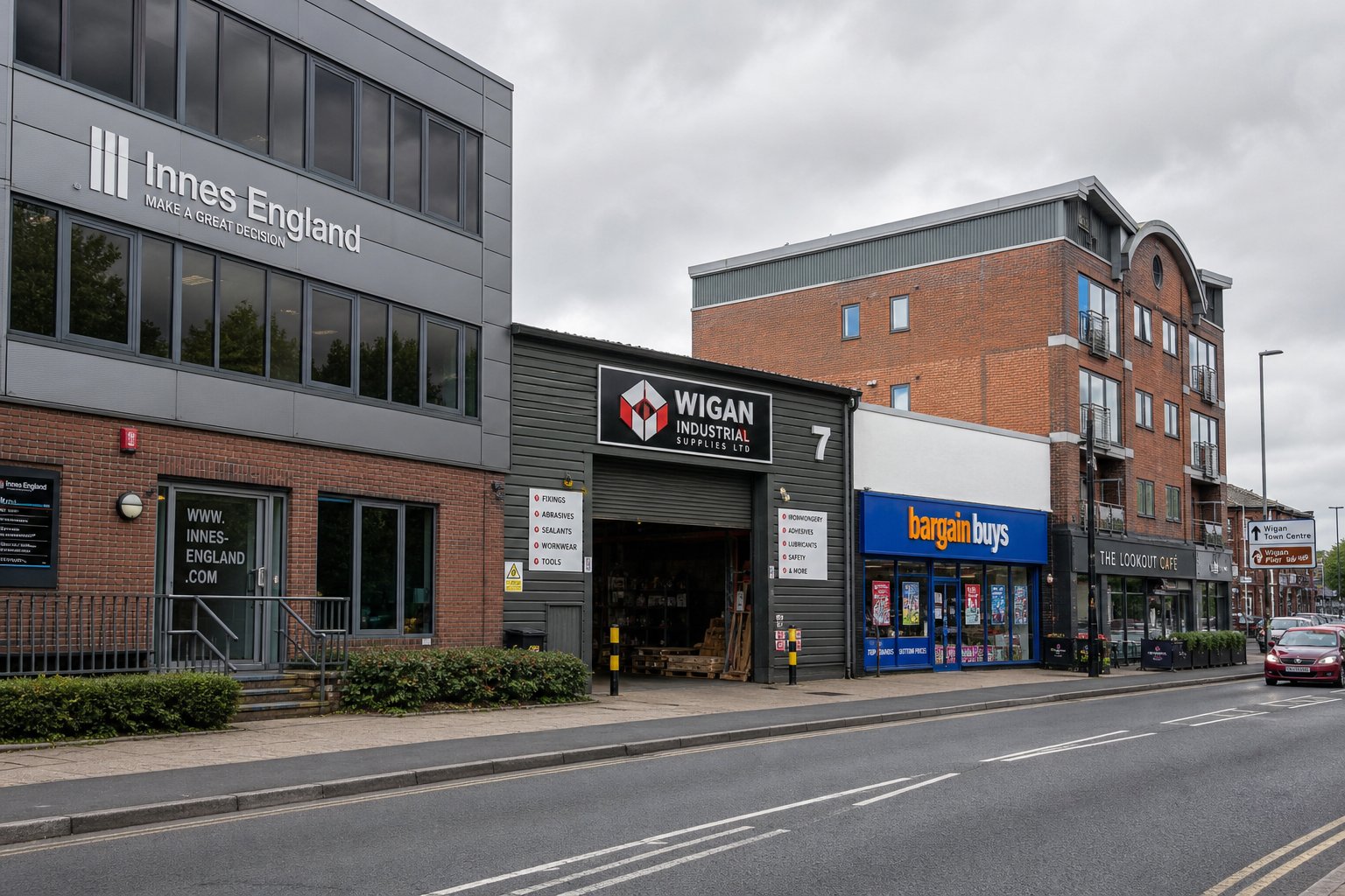 Different commercial property types in Wigan including office, retail, warehouse, and mixed-use buildings on a clean street.