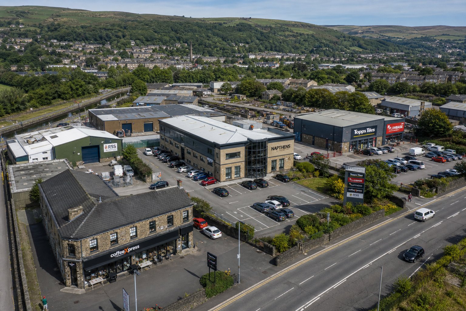 Aerial view of mixed-use commercial properties near Rawtenstall in daylight.