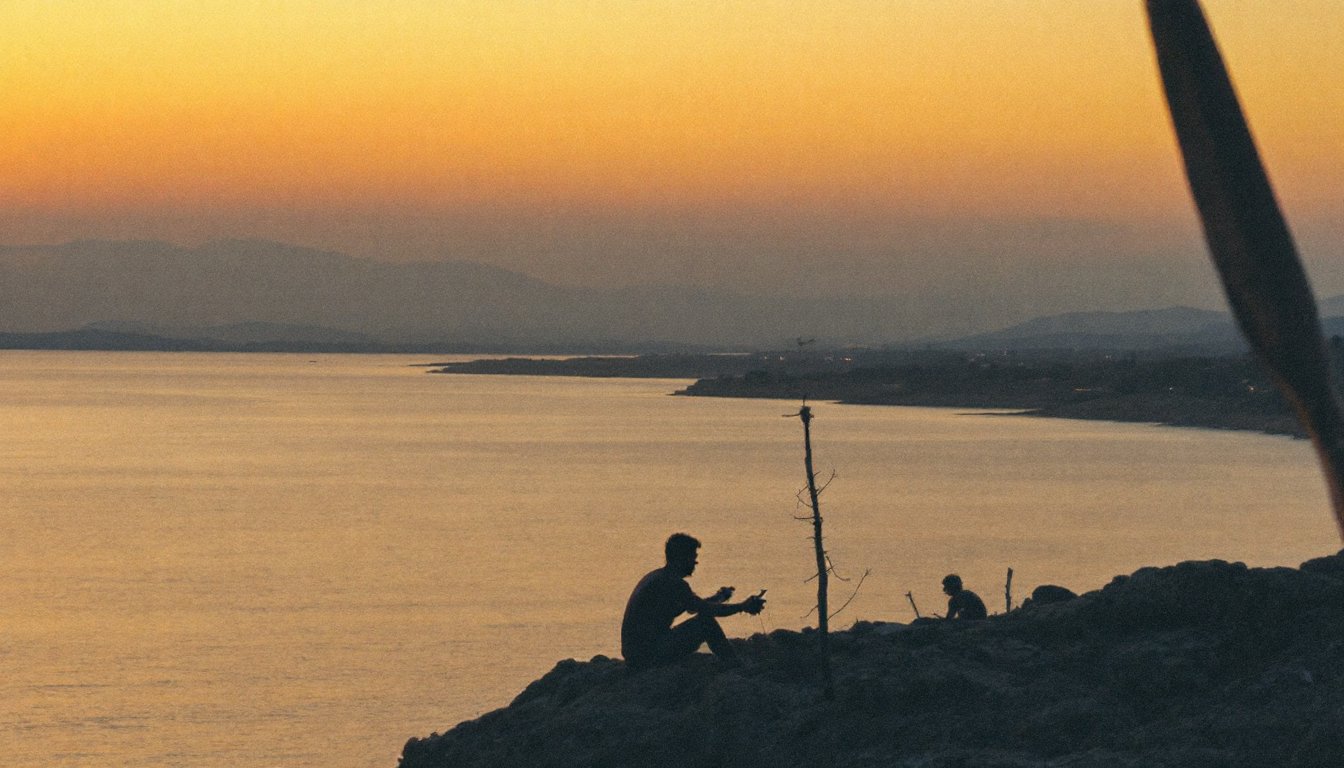 Woman with closed eyes taking a calm breath at her desk in morning sunlight.