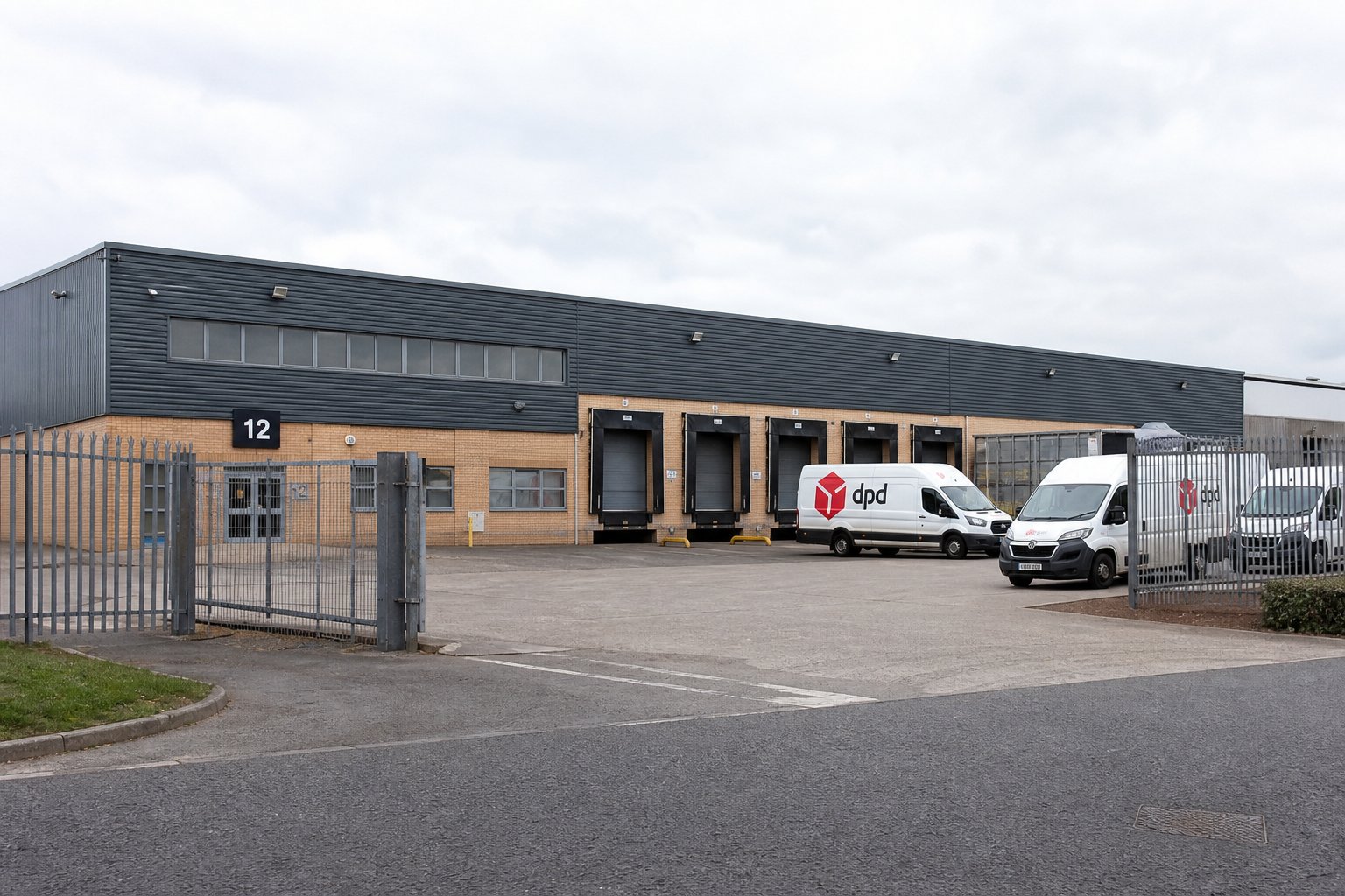 Commercial Mortgage Brokers Preston 12 Industrial warehouse exterior with loading bays and yard in Preston.