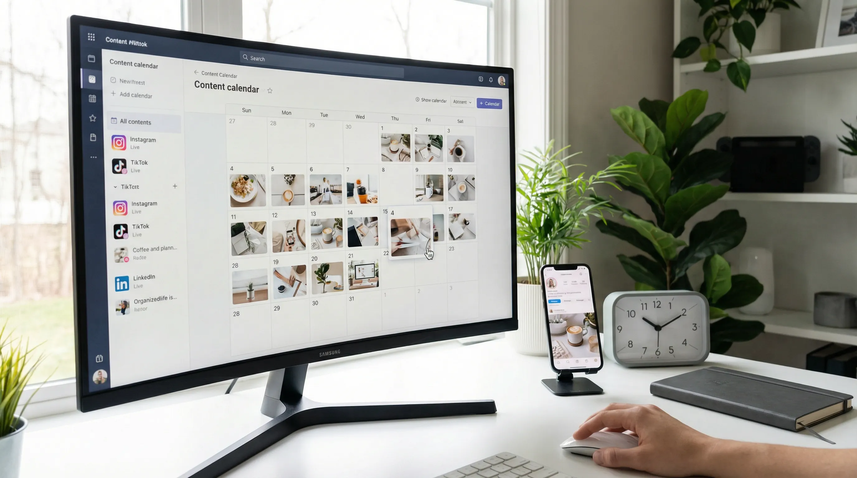 Organized desk with a social media content calendar on a monitor and scheduled posts visible, indicating consistent automated posting.