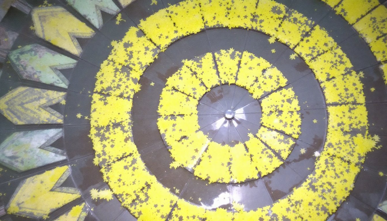 Woman massaging her feet with warm oil in a dimly lit bedroom at night.